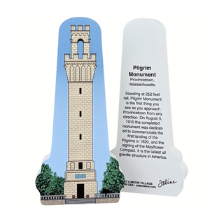 Wooden replica of  the Pilgrim Monument with descriptive text on a white background