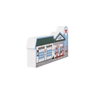 3/4" thick wood Model of a gas station with a white background