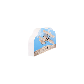 3/4" wooden replica with an illustration with a vintage airplane design on a white background