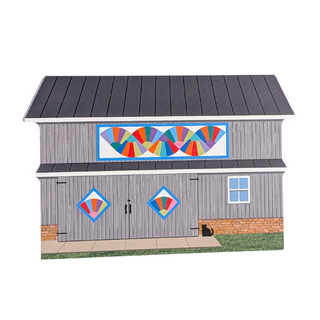 3/4" thick wooden illustration of a gray barn with colorful quilt designs on a white background