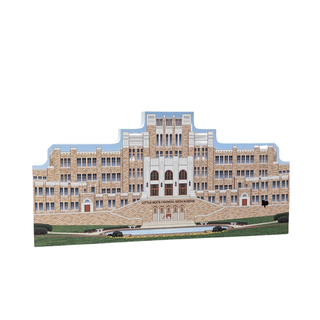 3/4" wooden replica with an illustration of a large brick building with a blue sky background