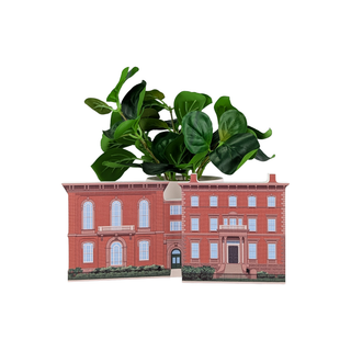 Potted plant on a miniature model of a red brick building