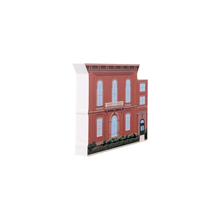 3/4" wooden replica with an illustration of a red brick building with white windows on a white background