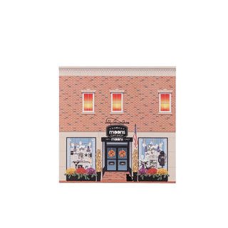 3/4" wooden replica with an illustration of a brick building with a store front and sign on a white background