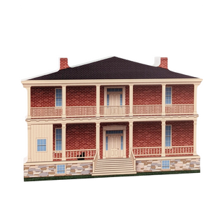 3/4" thick wooden illustration of a two-story house with brick facade and stone foundation on a white background