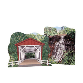 3/4" thick wooden illustrations of a covered bridge and a waterfall on a white background