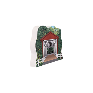 3/4" thick wooden illustration of a covered bridge on a white background
