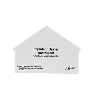 White house-shaped wooden replica with black text for Impudent Oyster Restaurant on a white background
