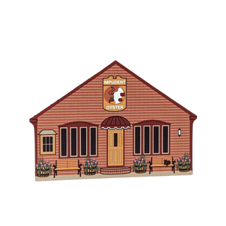 Wooden replica of a wooden building with a sign for 'Impudent Oyster' on a white background