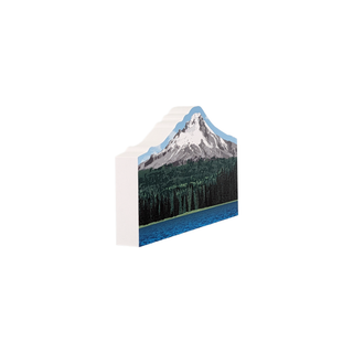 3/4" wooden cut out replica of an illustration of a snow covered mountain with a forest and lake 