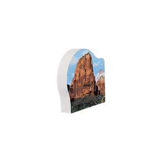 3/4" wooden replica with an illustration of a mountain landscape with blue sky and white clouds.