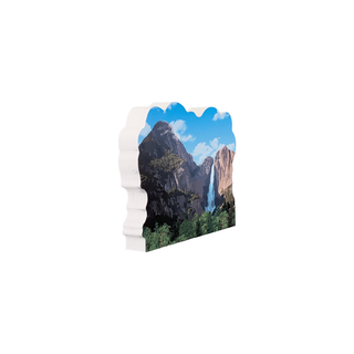 3/4" wooden replica with an illustration of a scenic landscape of mountains and trees on a white background