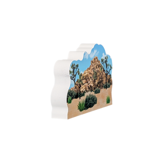 3/4" thick wooden illustration of a desert landscape with rocky outcrop, Joshua trees, and shrubs on a white background