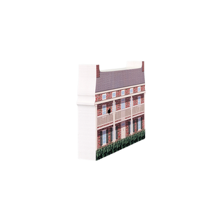 3/4" thick wooden illustration of a two-story brick house with a gray roof and green bushes in front on a white background.