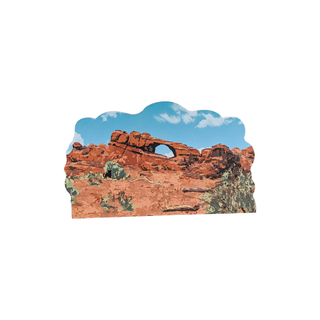 3/4" thick wooden illustration of a scenic view of a desert landscape with rock formations and blue sky.