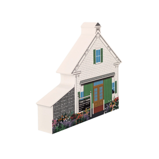 3/4" thick wooden Model of a house with a red door and flowers on a white background