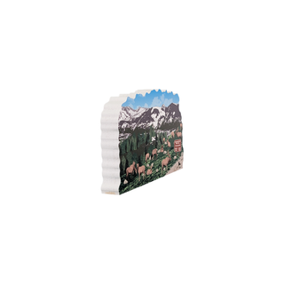 3/4" wooden replica with an illustration of  a mountain scene with animals and trees and snow