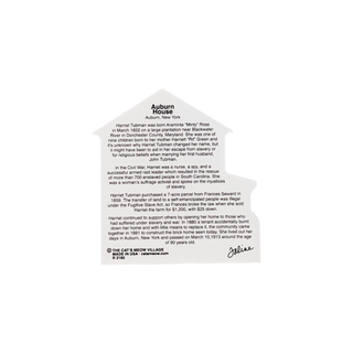 Back of a wooden replica featuring text about Harriet Tubman on a white background