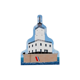 3/4" thick wooden replica with an illustration of  Michigan Harbor lighthouse, featuring a white tower, blue sky and water, and a tan base with a red, white, and blue flag, shown on a plain white background.