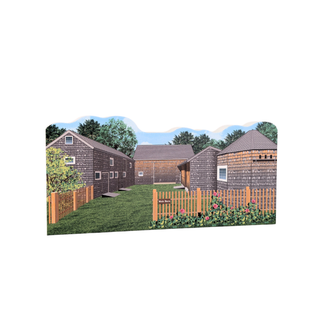 3/4" wooden replica with an illustration of a small village with houses and a fence on a white background