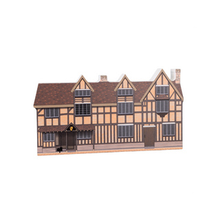 3/4" thick wooden cutout of a half-timbered house on a white background