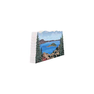 3/4" wooden cut out replica of an illustration of a mountain lake scene with trees and mountains.