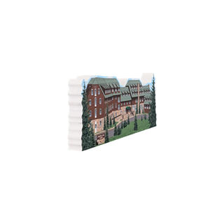 3/4" wooden cut out replica of an Illustration of a large brick building with greenery on a white background