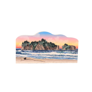 3/4" wooden cut out replica of an illustration of a Beach scene with ocean, sand, and cliffs at sunset