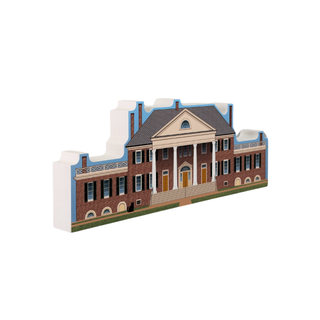 3/4" thick wooden cutout of  a large brick house with columns on a white background