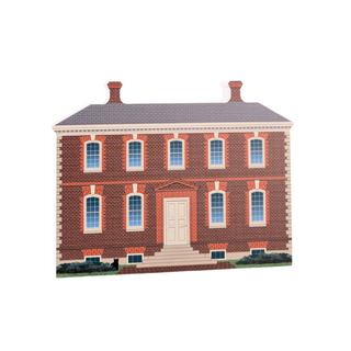 3/4" thick wooden cutout of  a two-story brick house with a gray roof and white door.
