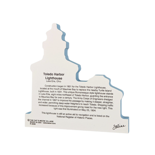 back of product with text about Toledo Harbor Lighthouse in the shape of the lighthouse on a white background