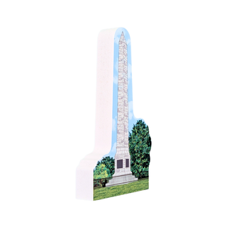 3/4" thick wooden replica with an illustration of a Washington Monument, printed with a light blue sky, green trees, and grass, shown on a plain white background.