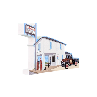 3/4" thick wooden replica with an illustration of a white building with a sign reading 'L. McGill' and a vintage brown pickup truck parked in front, shown on a plain white background.