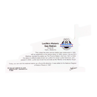 back of product with text about 'Lucille's Historic Gas Station' with a Route 66 Centennial emblem, photographed against a plain white background.