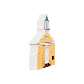 3/4" thick wooden replica with an illustration of a church building model or package shown on a plain white background. The design features a white exterior, a pale yellow front wall, a white door, dark brown steps, and a blue-and-white steeple with a small arched window.