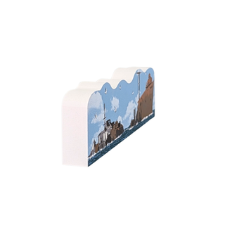 3/4" thick wooden figurine of a sunken ship in the water on white background