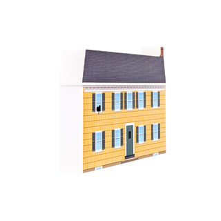 3/4" thick wooden replica with an illustration of a house-shaped product, likely a model or decorative item, with yellow siding, a dark gray roof, blue windows, and a gray front door, shown on a plain white background.