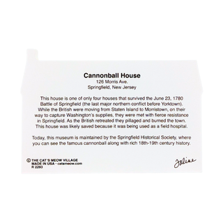 Back of 3/4" thick wooden replica  with printed text about Cannonball House in Springfield, New Jersey, including a title, address, historical description, and a signature at the bottom right. The sign is photographed against a black background.