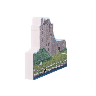 3/4" thick wooden cutout of  a castle with a landscape background on a white card