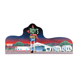 3/4" thick wooden replica with an illustration of a retro motel scene at night. The design shows a large 'ROY'S MOTEL CAFE' sign with red and blue neon-style panels, white motel buildings, trees, mountains, and a starry sky.