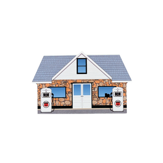 3/4" thick wooden replica with an illustration of a a gray shingled roof, tan stone facade, white double doors, two windows, and two white gas pumps in front, shown on a plain white background.