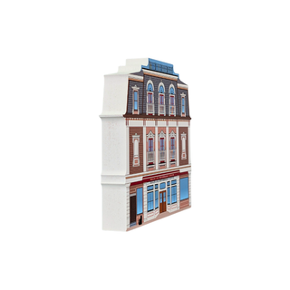 3/4" thick wooden replica with an illustration of a European townhouse facade, featuring brown brickwork, white trim, blue roof tiles, and detailed window designs, isolated on a white background.