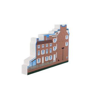 3/4" thick wooden replica with an illustration of a brick building with white accents on a white background