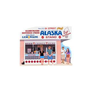 3/4" thick wooden replica with an illustration of a Alaska Lemonade stand, featuring illustrated characters ordering from the counter and a clean white background.