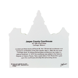 A white stone-look decorative sign shaped like the Jasper County Courthouse, featuring printed text about the courthouse and a small signature at the bottom, shown on a plain white background.