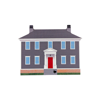 3/4" thick wooden replica with an illustration of a two-story house with dark gray siding, a red front door, white trim, blue-tinted windows, a brick base, gray roof, and small black chimneys, centered on a plain white background.