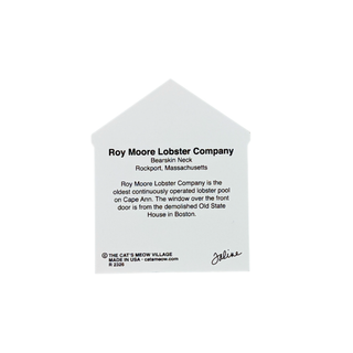 A white house-shaped memorial plaque featuring printed text about Roy Moore Lobster Company, including a signature and copyright details, shown on a plain white background.