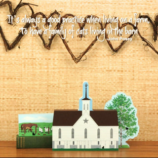 Decorative scene with 3/4" thick wood models of a small barn, tree, and farm animals on a wooden surface with a rustic background.