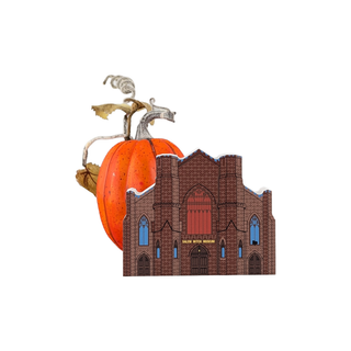 Decorative pumpkin with a castle design on a white background