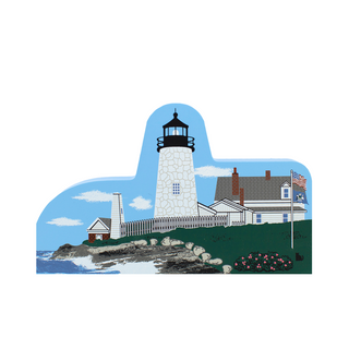 3/4" thick wooden Lighthouse and surrounding buildings on a decorative cutout with blue sky and green ground.